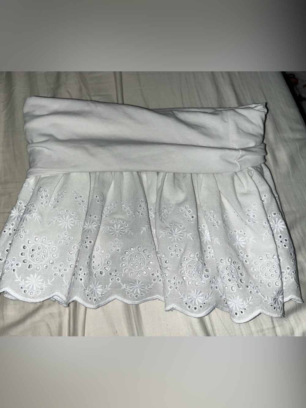 Subdued fold over white skirt